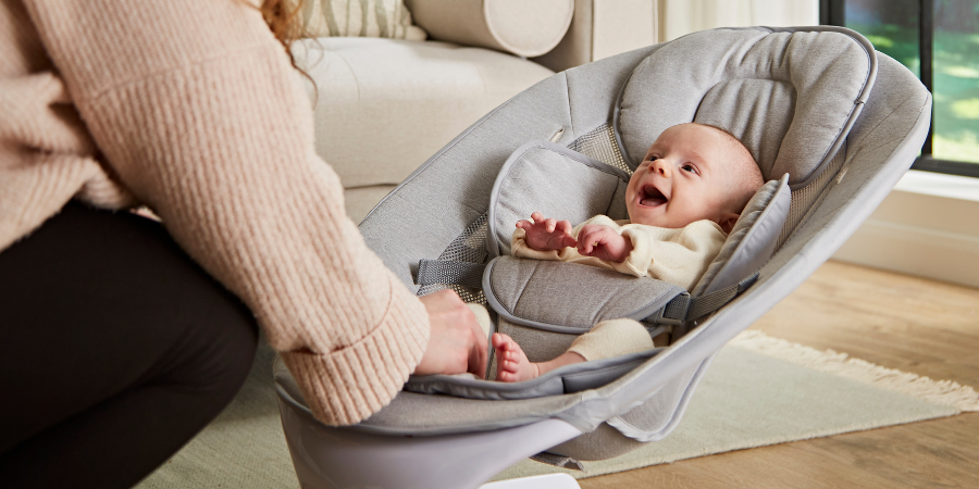 Smiling baby in The Babocush Baby Swing & Rocker