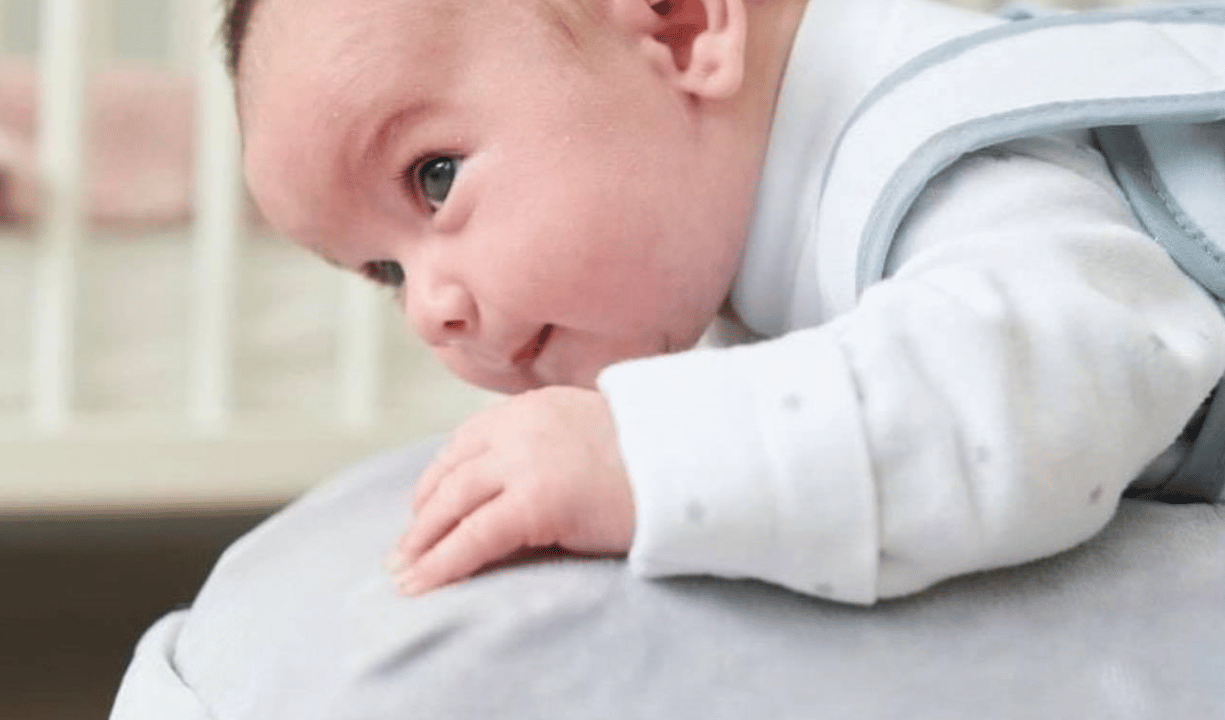 Baby boy on Babocush Cushion doing tummy tum