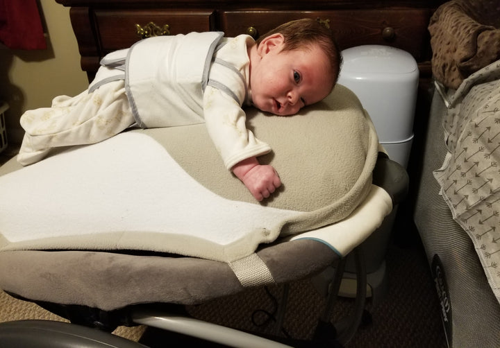 Wyatt Arnold, who was born 10 weeks premature, relaxing on his Babocush