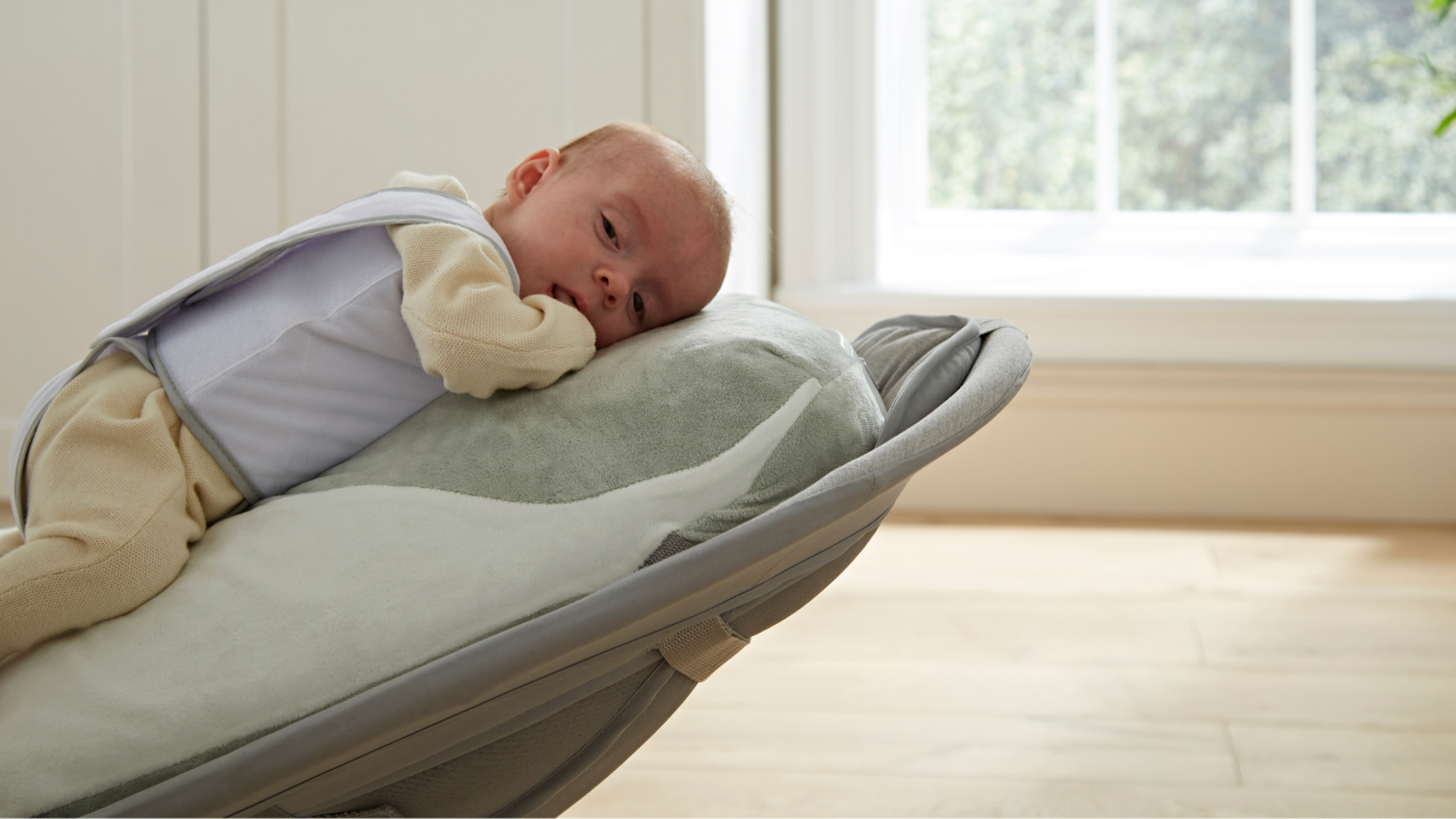 Content baby on the Babocush Cushion and Swinging Rocker Combo